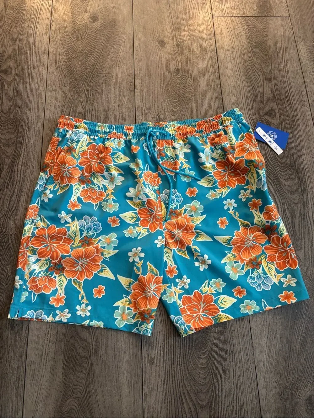 Hurley men’s  Teal Floral Swim Trunks - Vibrant Orange Hibiscus